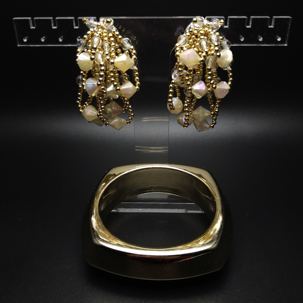 Gold enamel bracelet and gold & cream aurora borealis beaded clip earrings.